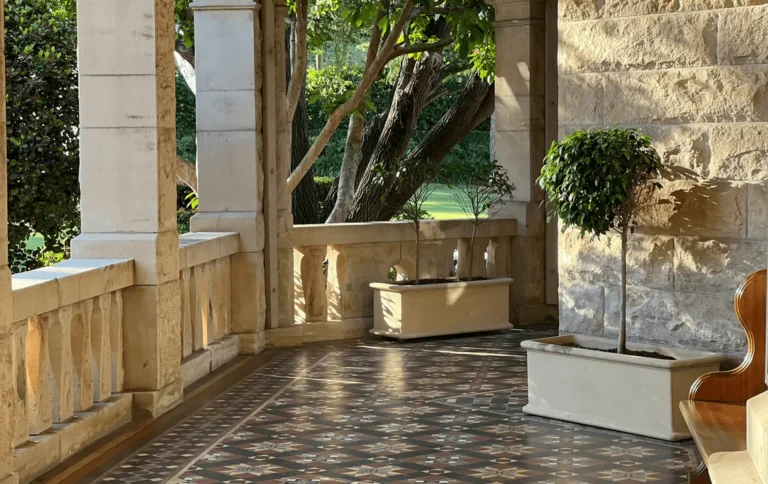 Decorative tessellated tiles on a sheltered stone verandah