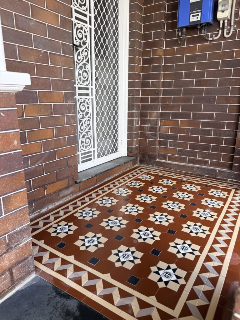 NightBridge tessellated entrance tiles with a Balmain border and EN-29 quatrefoil centres in Coogee