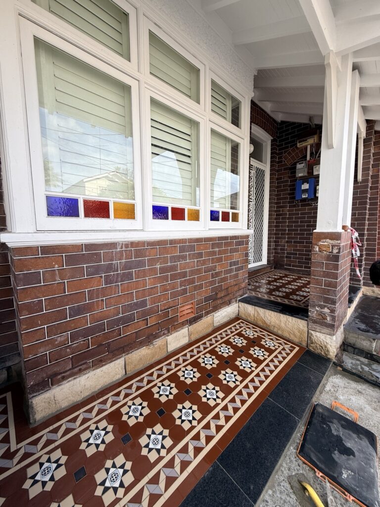 NightBridge verandah tiles with a Balmain border beneath the windows of a Coogee home