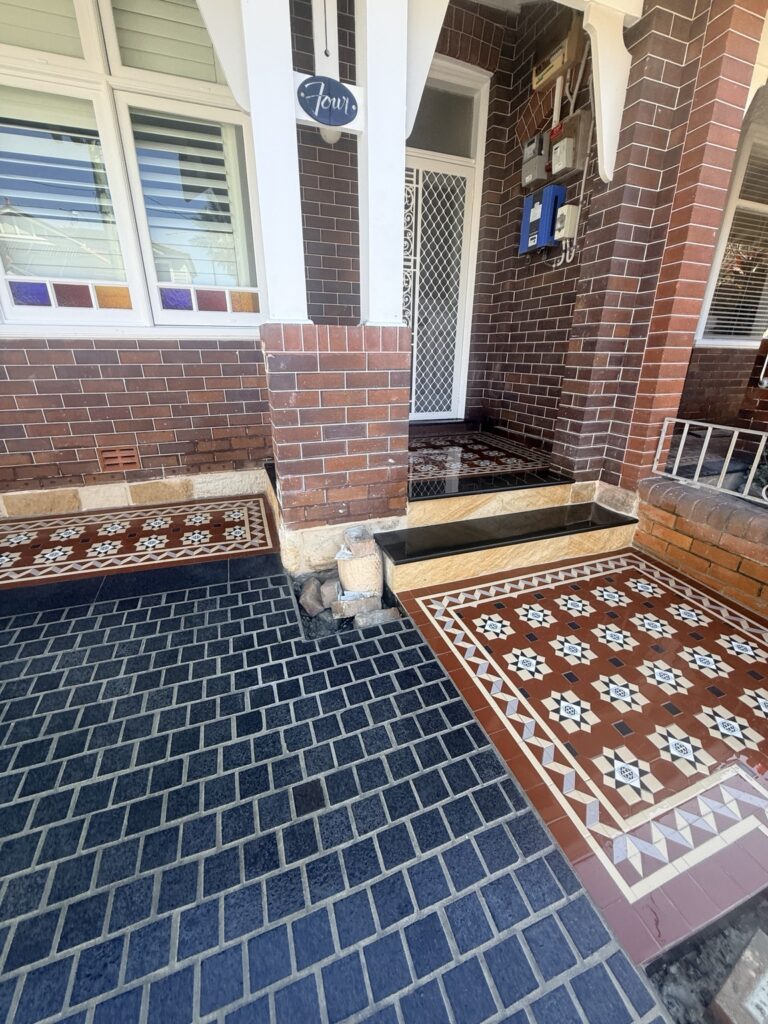 Coogee verandah and entrance showing NightBridge tiles beside the brick facade