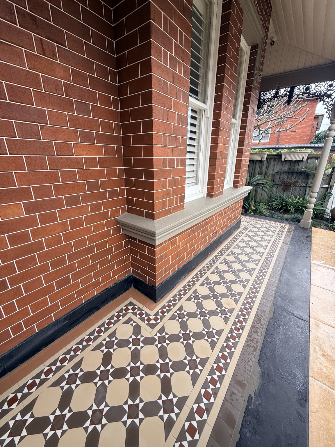 Close-up of Nottingham tessellated tiles and a Windsor border on a Drummoyne verandah